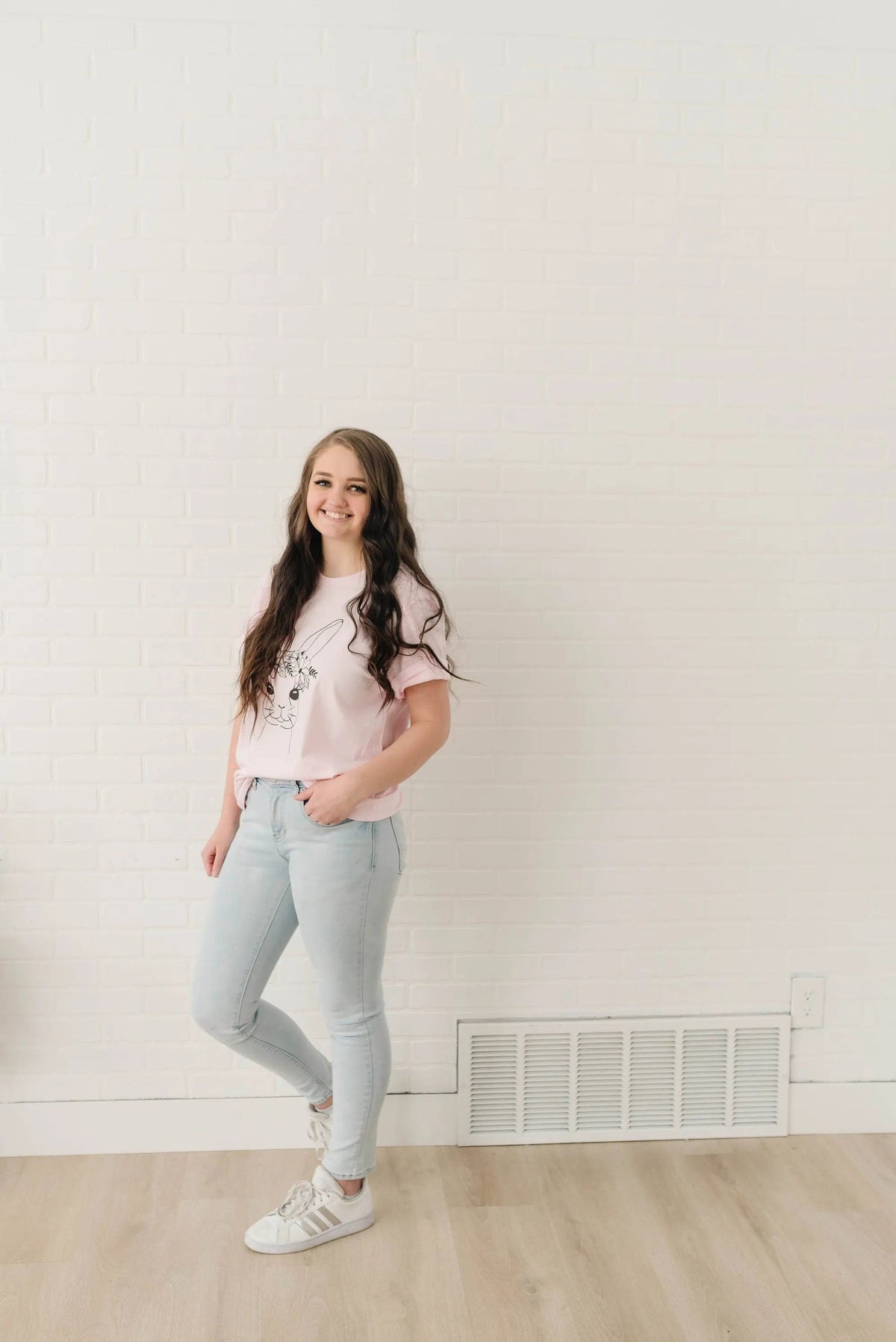Light pink women’s Easter bunny t-shirt with floral bunny graphic and crew neck
