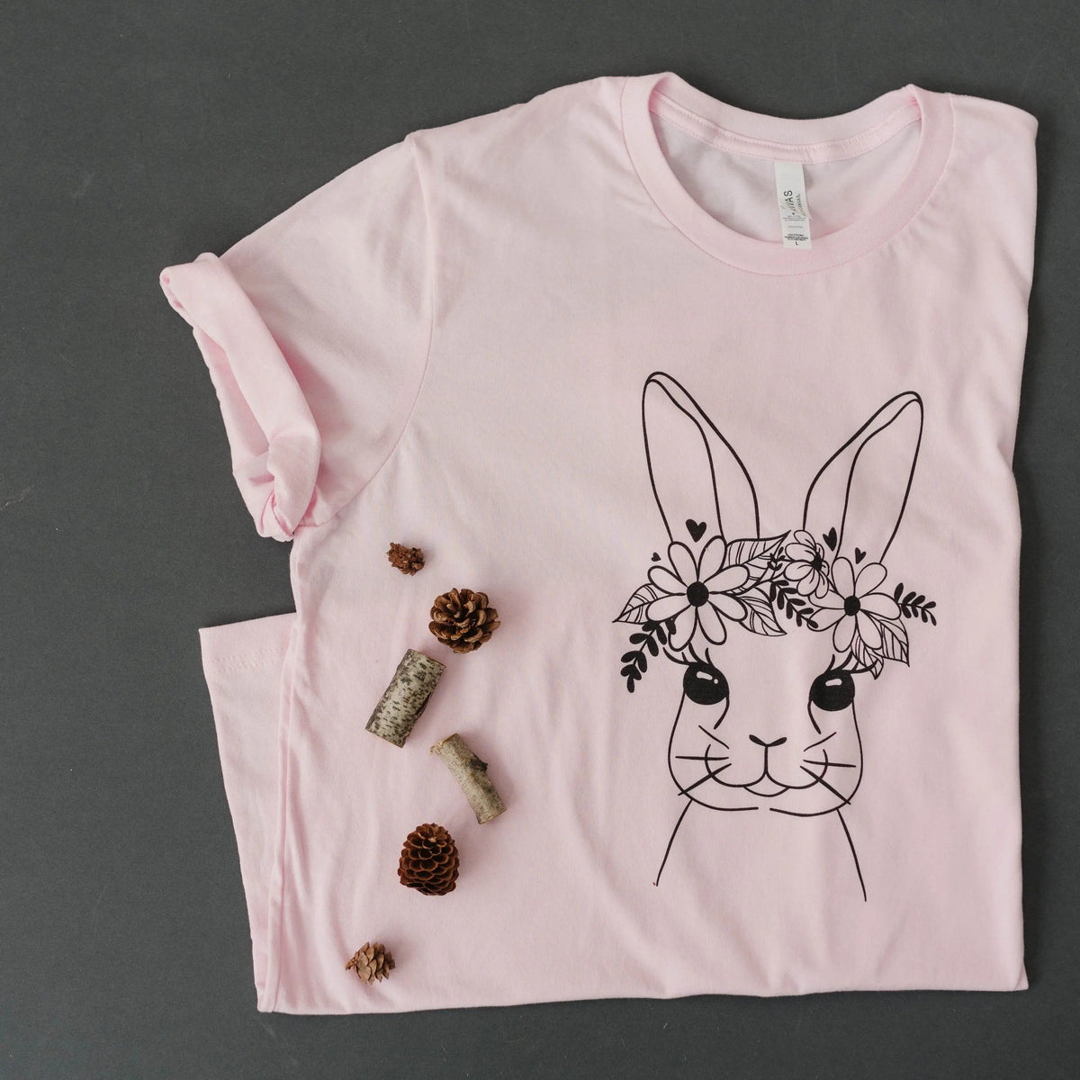 Light pink women’s Easter bunny t-shirt with black floral bunny face print