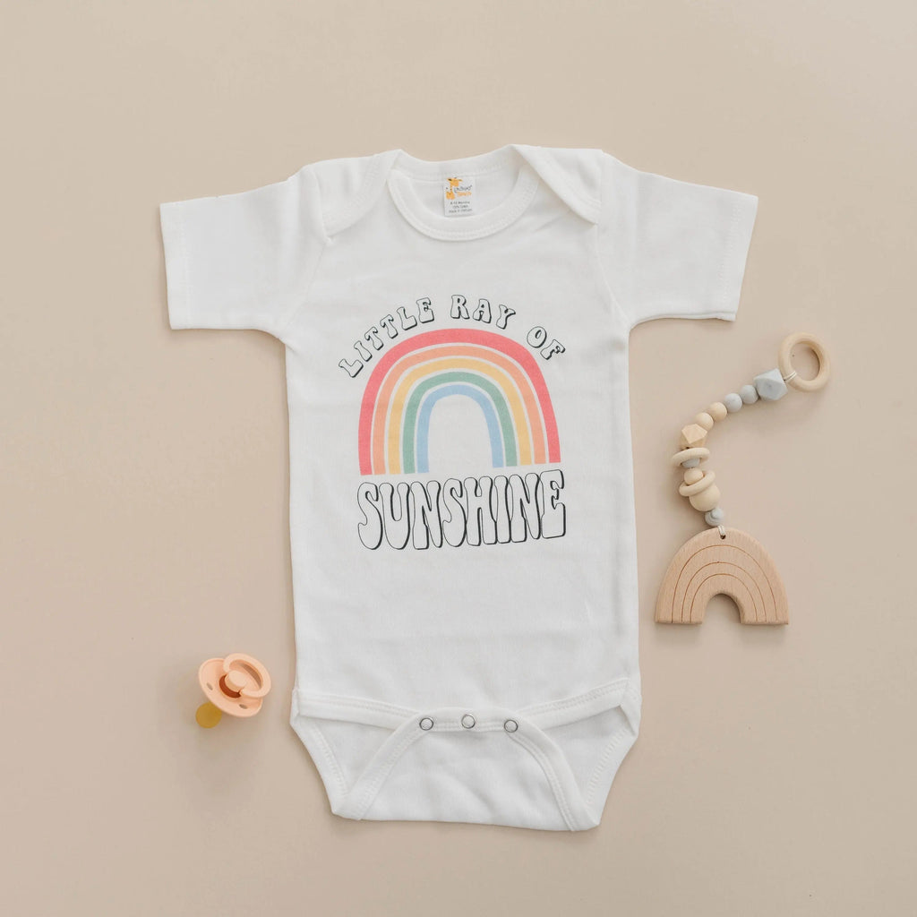 White short-sleeve baby bodysuit with rainbow “Sunshine” front print, snap bottom