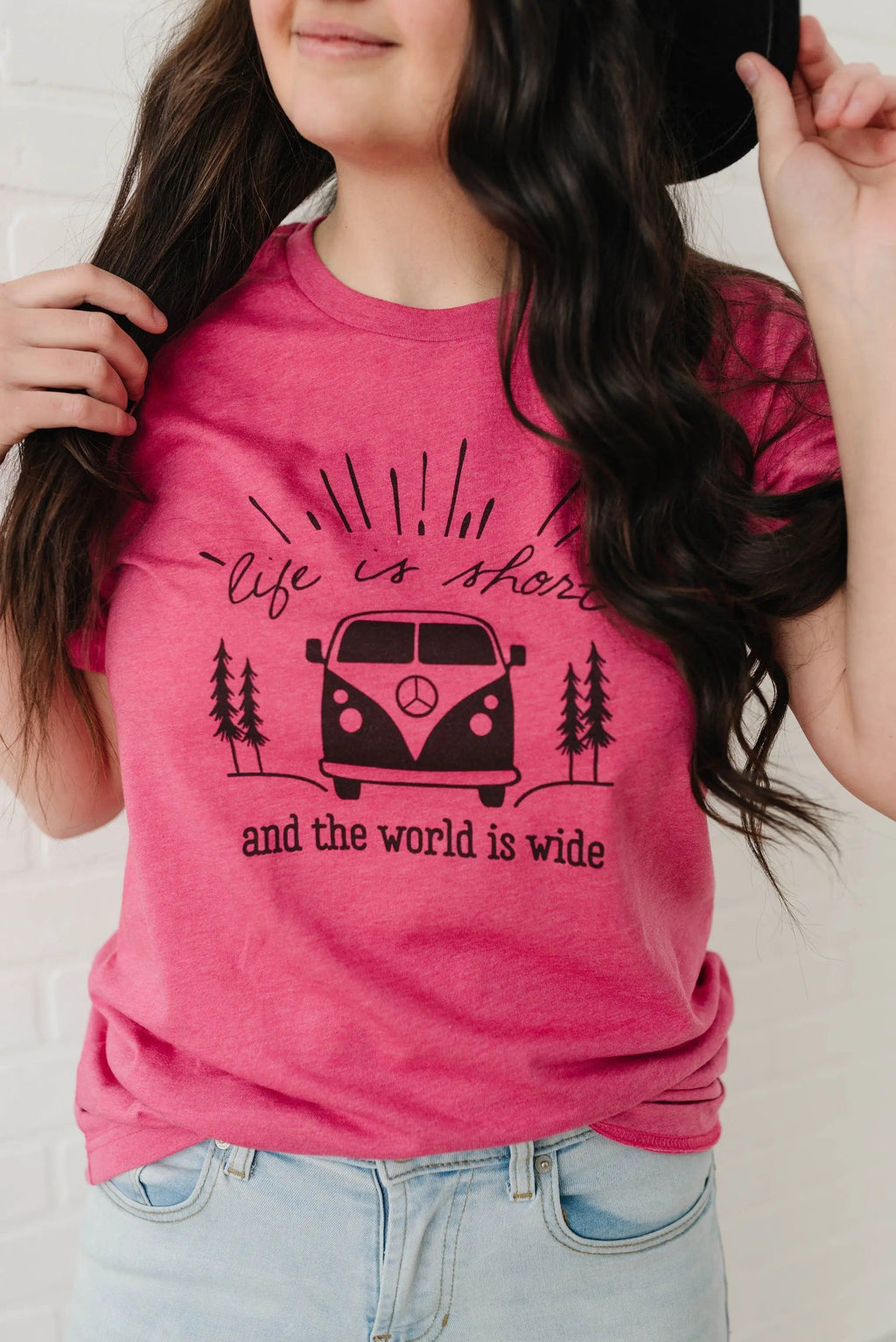Women’s pink graphic t-shirt with camper van, trees, and “Life is short” text