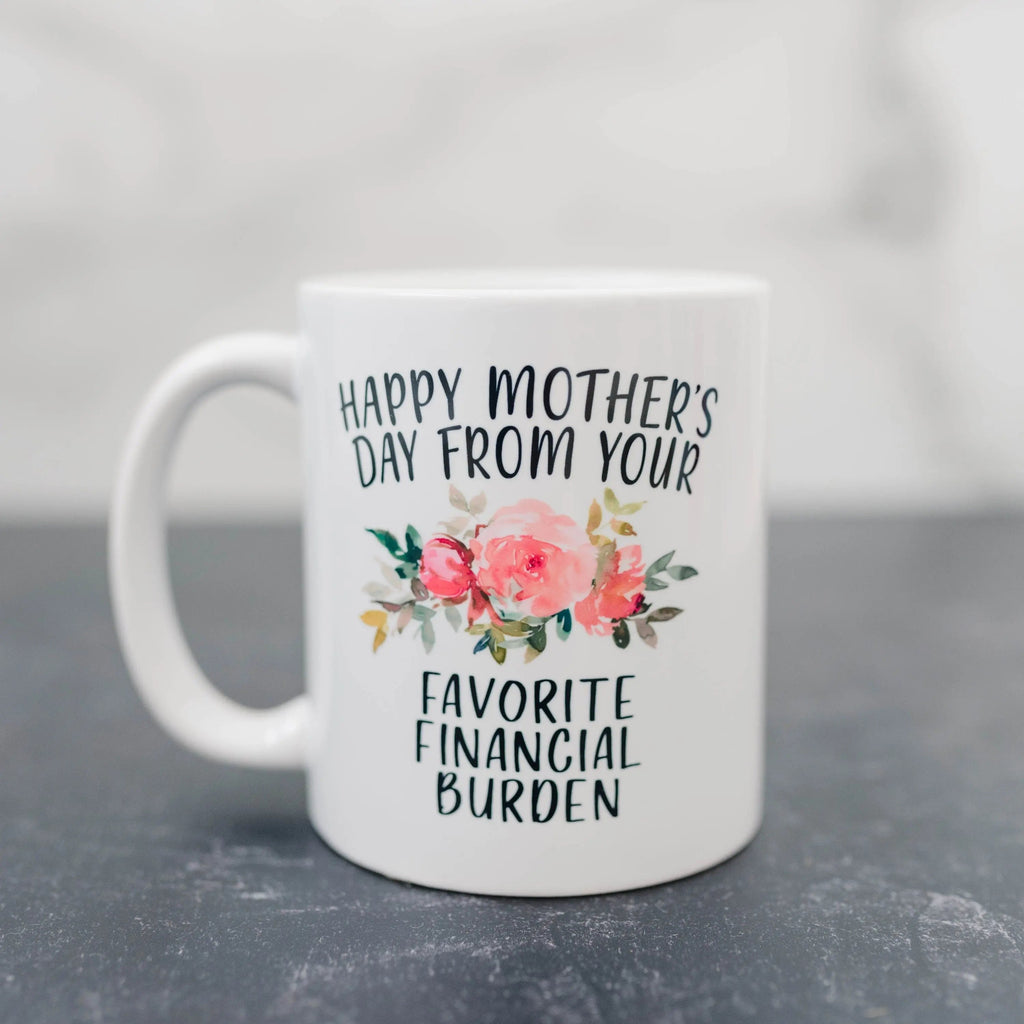 White ceramic coffee mug with floral “Happy Mother’s Day” and “Favorite Financial Burden” text