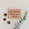 Wood business card holder with engraved text “Photography by Kim”