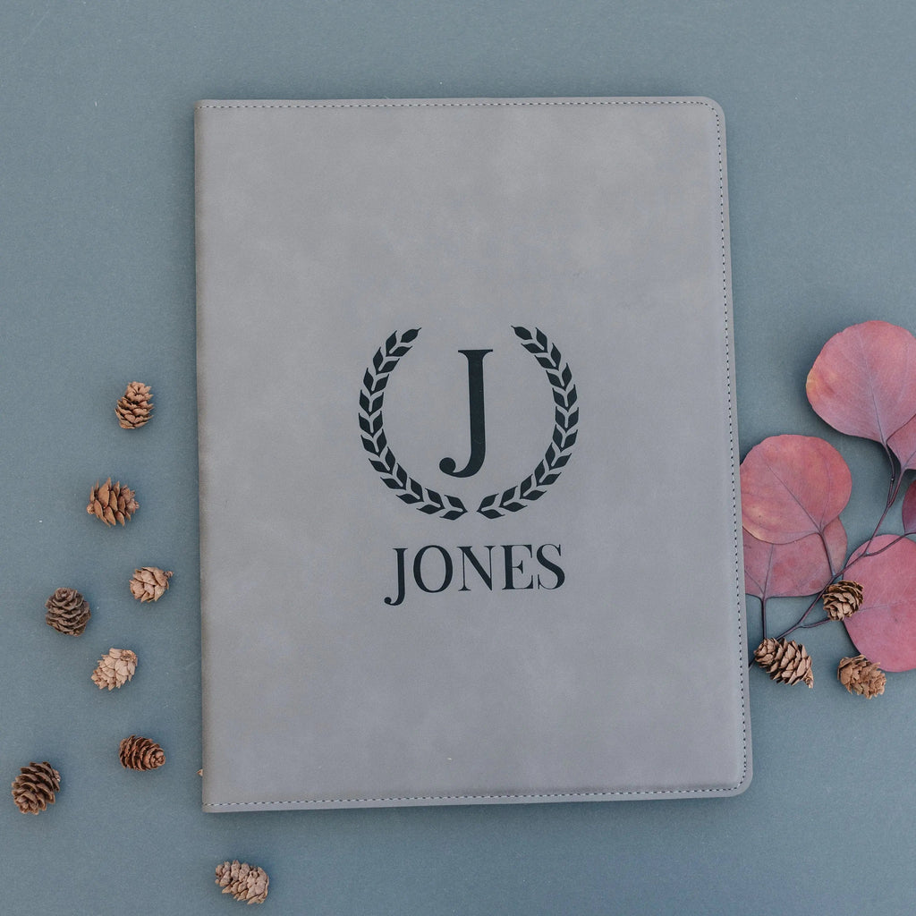 Gray legal pad portfolio with engraved monogram J and JONES on front cover