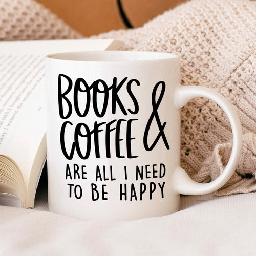 White ceramic coffee mug with 'BOOKS & COFFEE' and 'TO BE HAPPY' text