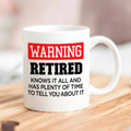 White mug: red 'WARNING RETIRED' and black 'plenty of time' text