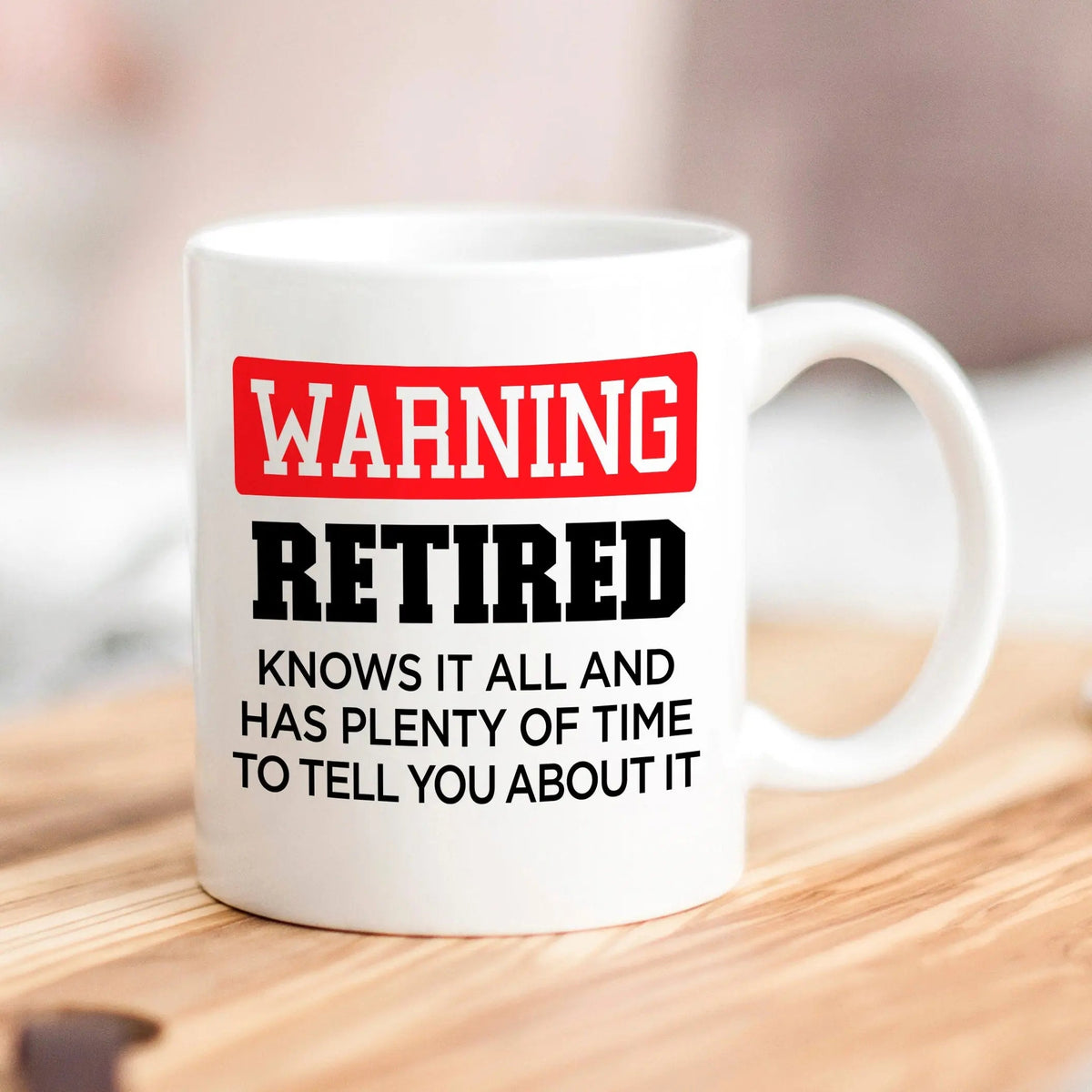 White mug: red 'WARNING RETIRED' and black 'plenty of time' text
