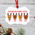 White reindeer family ornament with four reindeer portraits and red ribbon