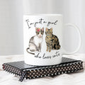 White ceramic cat mug with two cat graphics and script text, rounded handle