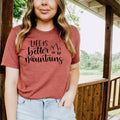 Women’s maroon T-shirt with “Life is better in the mountains” mountain lettering graphic