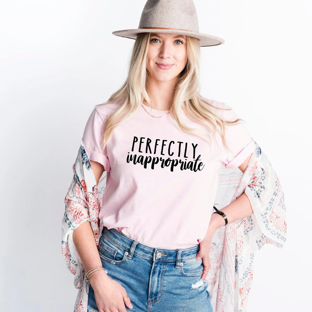 Light pink unisex T-shirt with "PERFECTLY inappropriate" printed across chest
