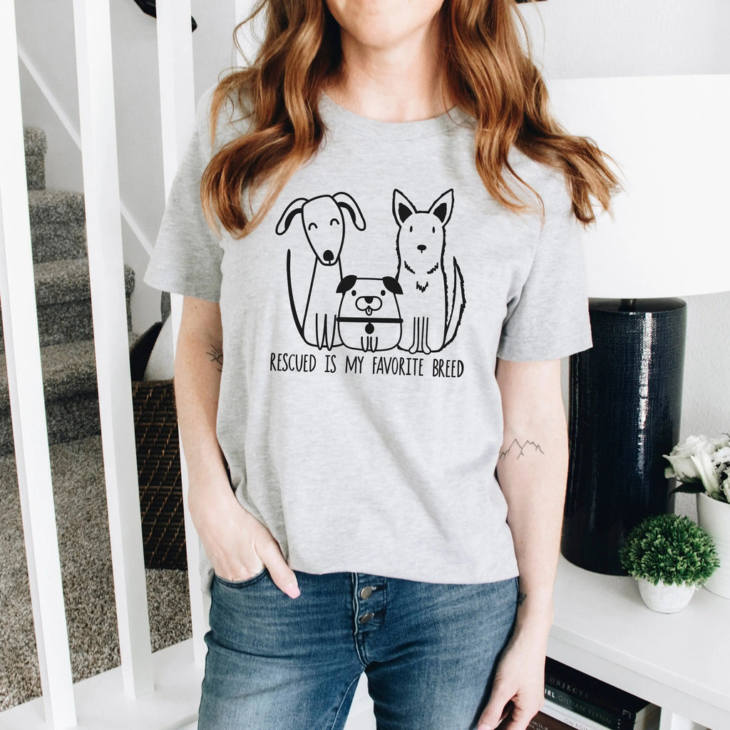 Gray unisex T-shirt with dog rescue graphic and text: “Rescued is my favorite breed”.