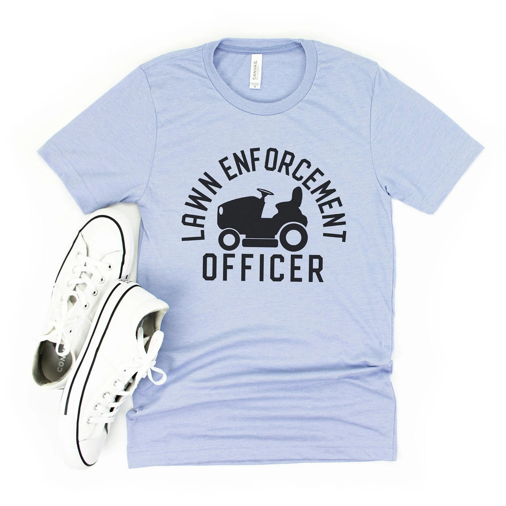 Light blue unisex T-shirt with black “Lawn Enforcement Officer” tractor graphic
