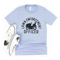Light blue unisex T-shirt with black “Lawn Enforcement Officer” tractor graphic
