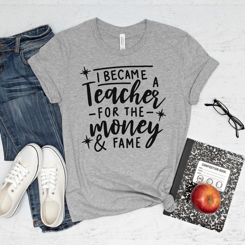 Heather gray unisex teacher T-shirt with 'I became a Teacher for the money & fame' print