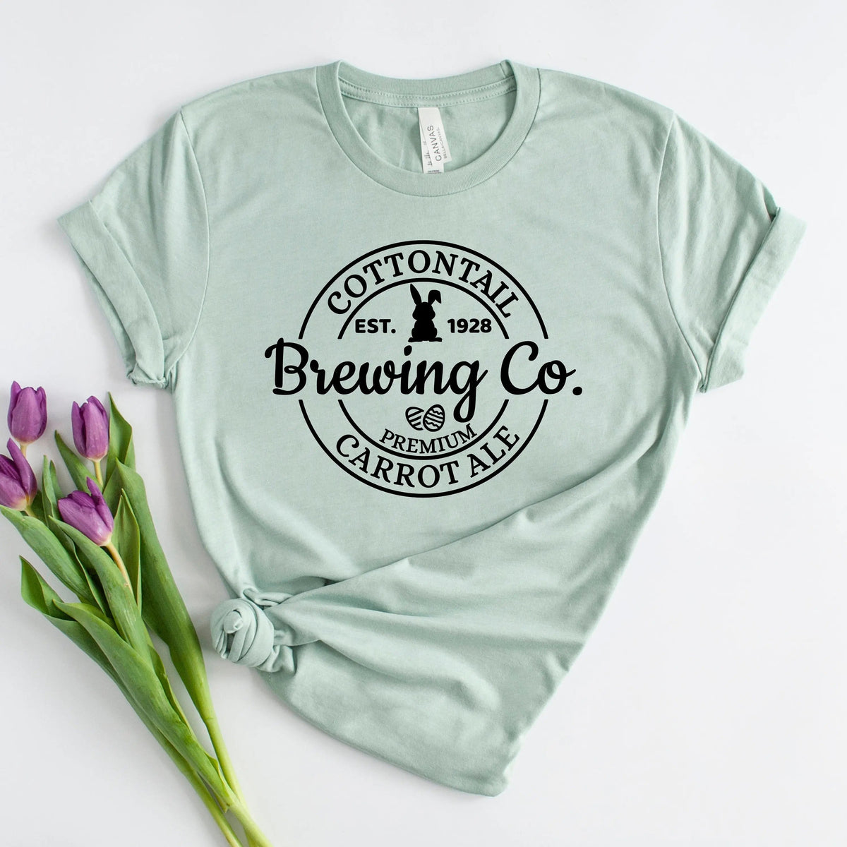 Mint green women’s T-shirt with “Brewing Co.” carrot logo on chest