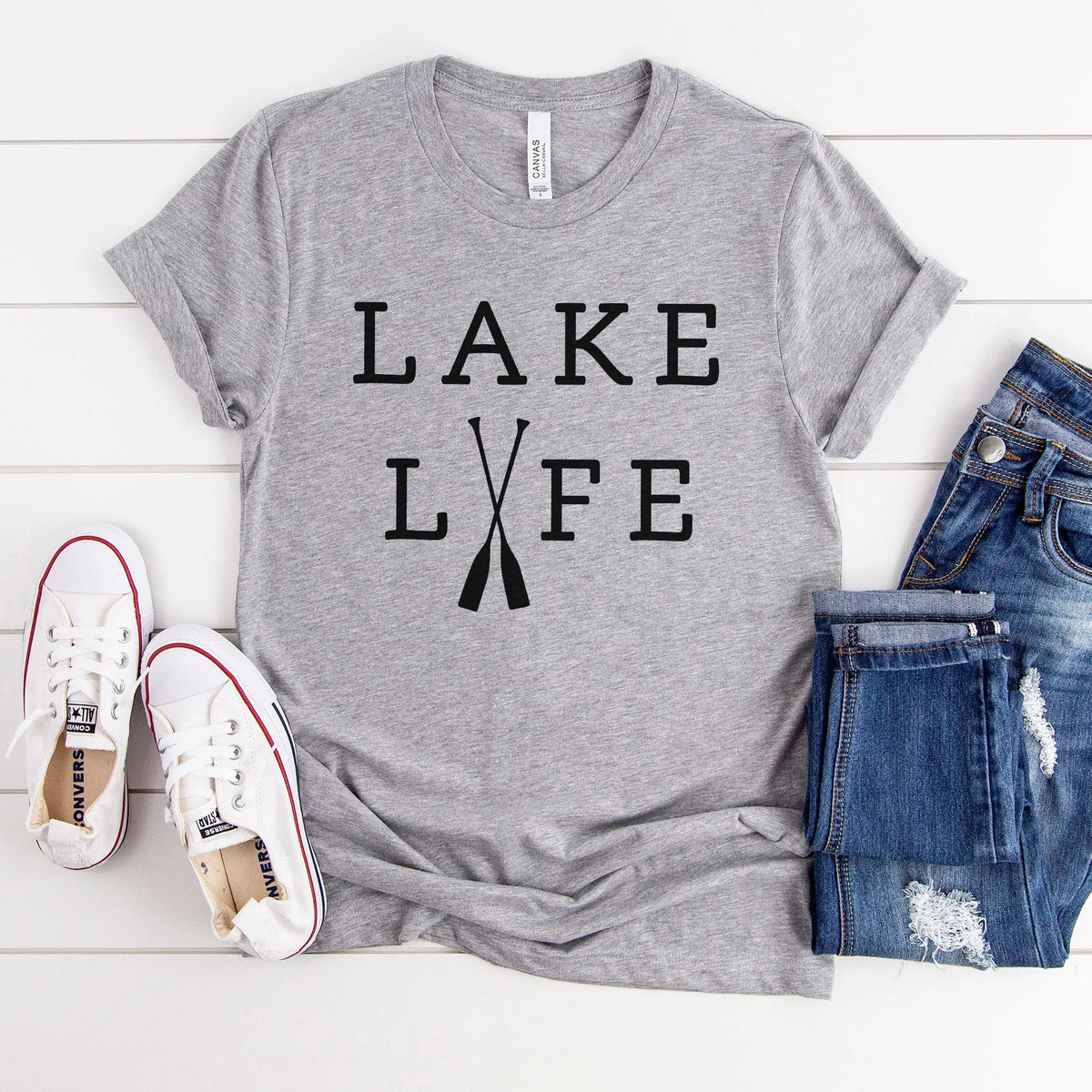 Light gray unisex T-shirt with bold black “LAKE LIFE” text on the front