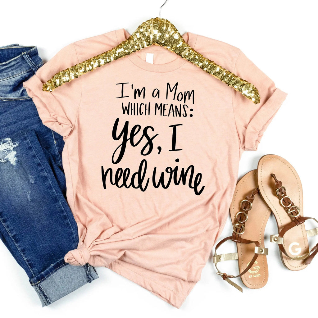 Pink unisex t-shirt with glitter gold-arch neckline and “I’m a Mom” quote graphic