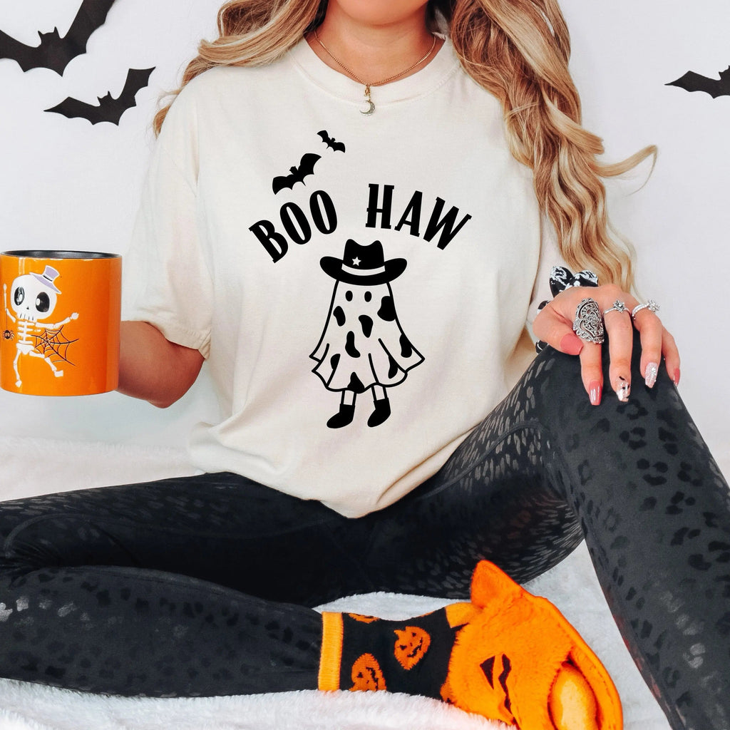 Ivory Halloween t-shirt with black “BOO HAW” cowgirl graphic