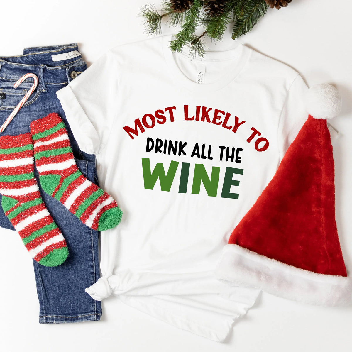 White Christmas T-shirt with red and green text: “Most likely to drink all the wine”
