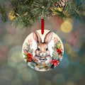 Personalized bunny Christmas ornament, round design with bunny face, wreath, and red ribbon; Nicole 2023