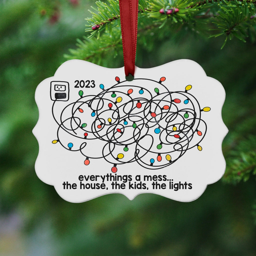 Cloud-shaped 2023 Christmas ornament with red hanging ribbon and colorful light doodles