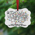 Cloud-shaped 2023 Christmas ornament with red hanging ribbon and colorful light doodles