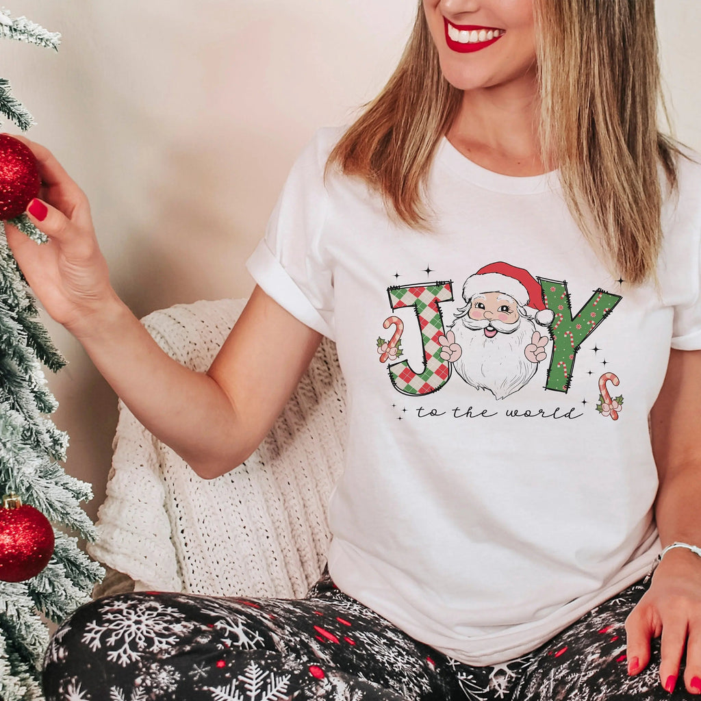 White crewneck Christmas t-shirt with Santa graphic and 'to the world' text