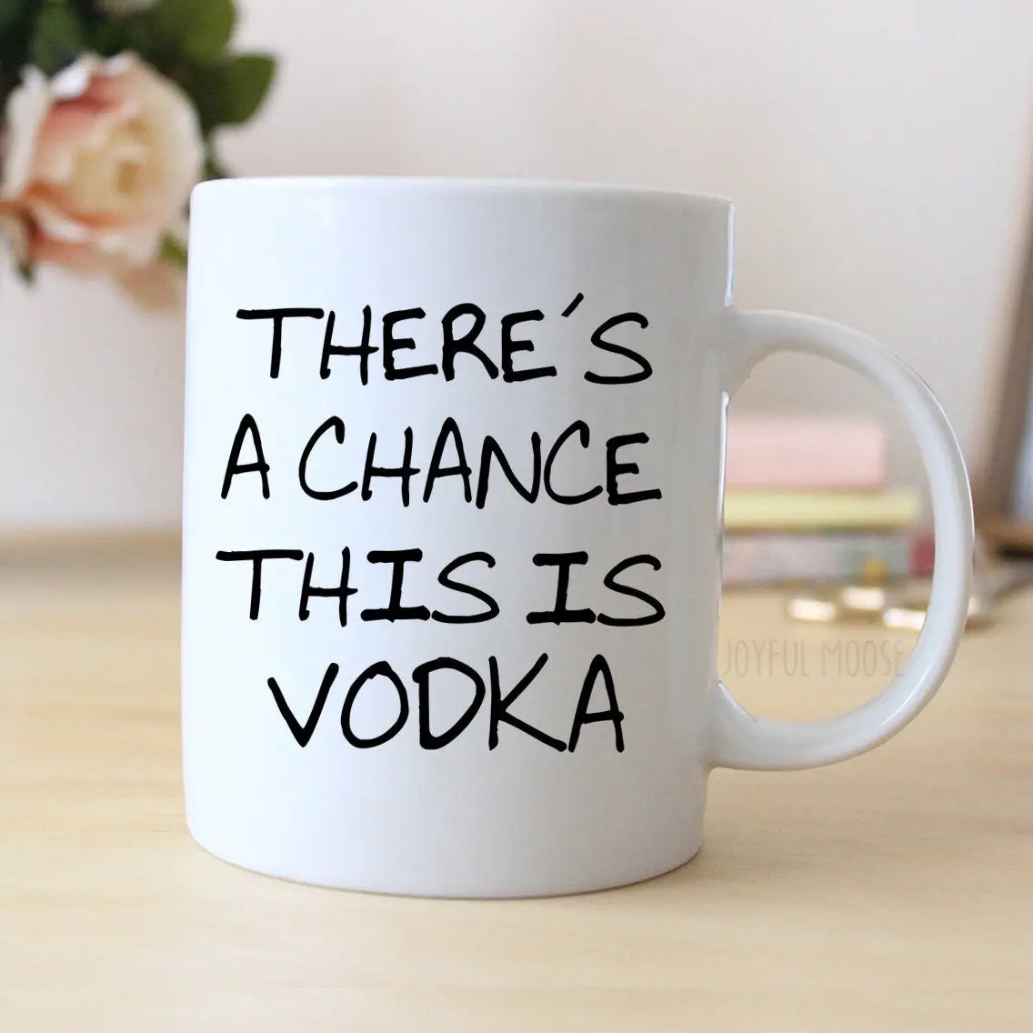 White coffee mug with 'THERE'S A CHANCE THIS IS VODKA' slogan and side handle
