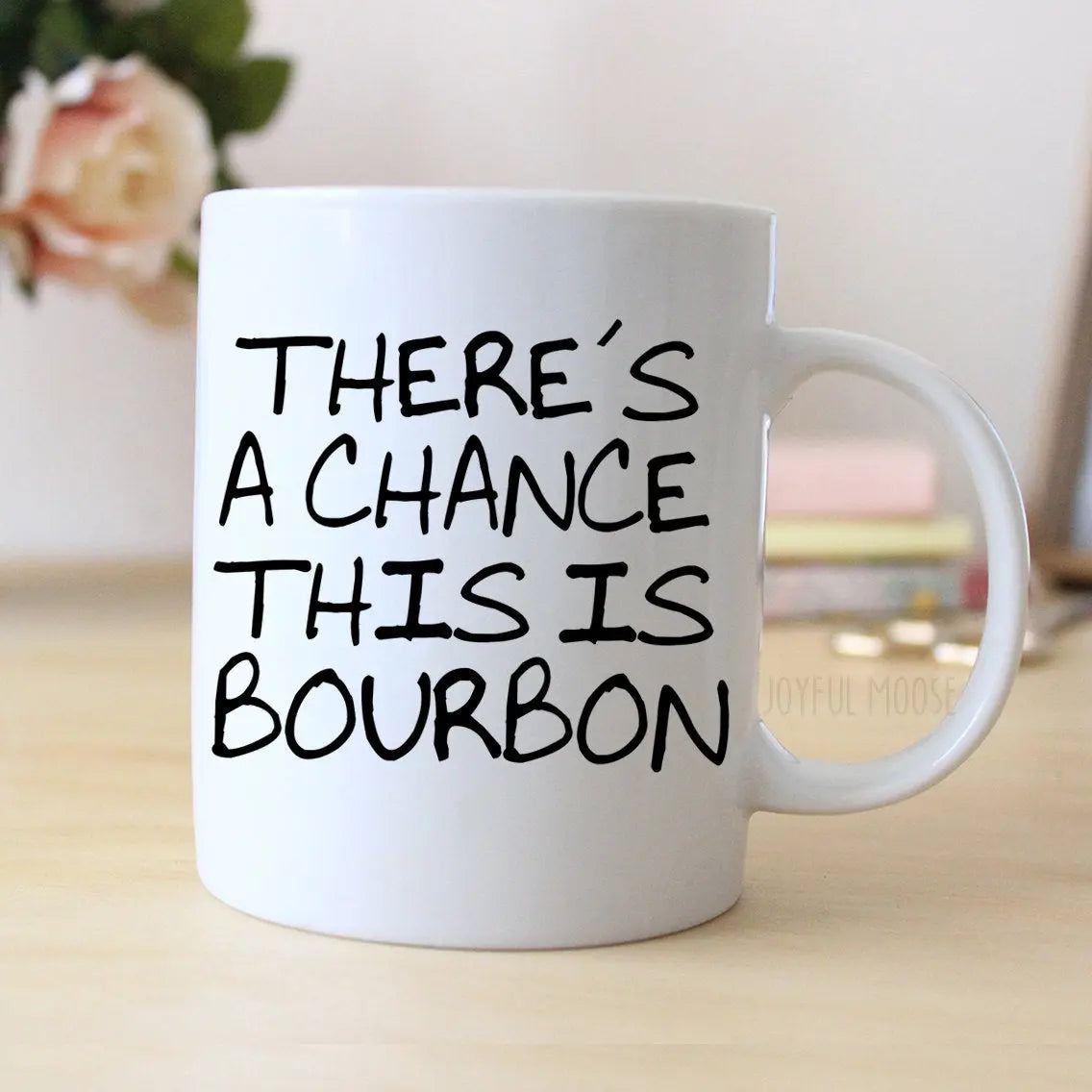 White coffee mug with black "THERE'S A CHANCE THIS IS BOURBON" saying