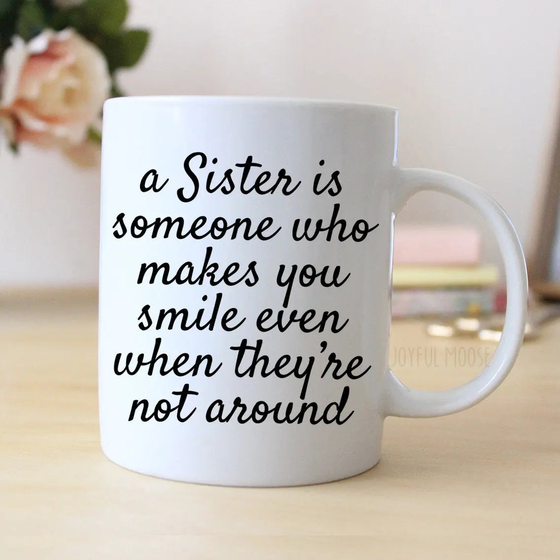 White coffee mug with sister quote: 'a Sister is someone who makes you smile even when not around'