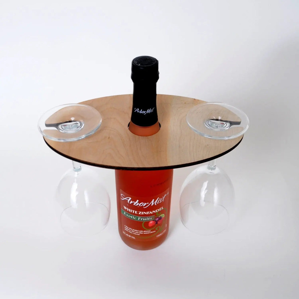 Wooden wine glass carrier with three stem holes, styled with a bottle and two stem glasses.
