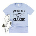 Light blue crewneck graphic T-shirt with vintage car and text 'I'm not old, I'm a classic'