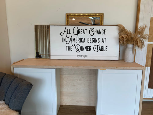 Wooden wall sign with quote text, black lettering on white panel