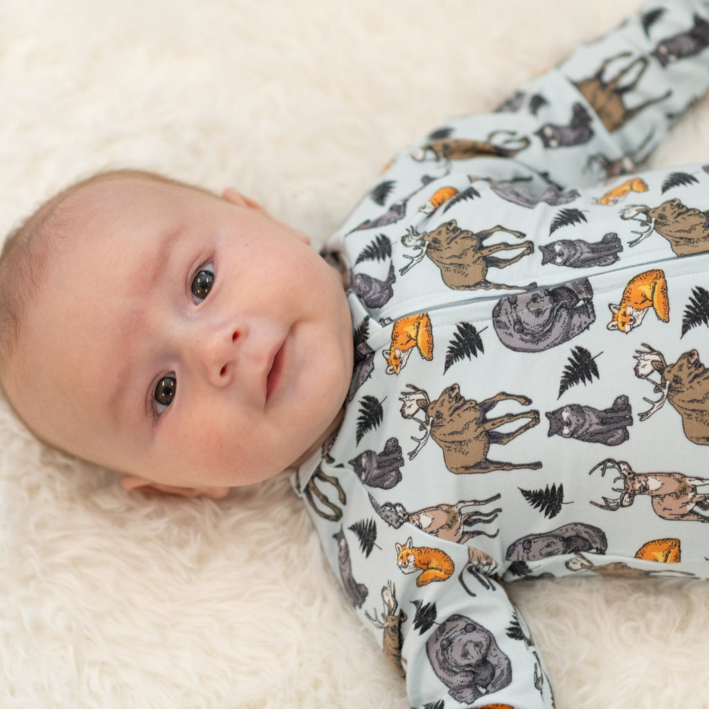 Light blue animal print zipper footie with long sleeves, close-up
