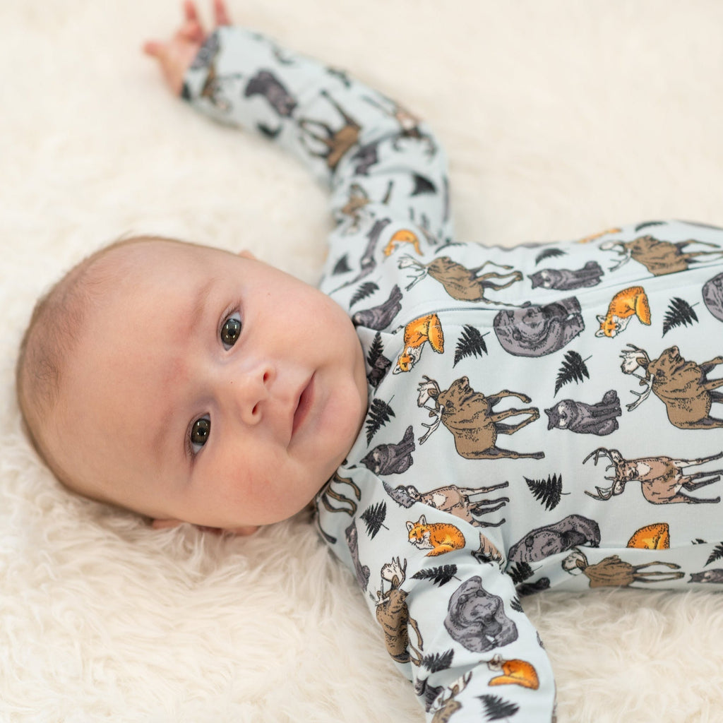 Light blue animal print zipper footie with long sleeves and covered feet