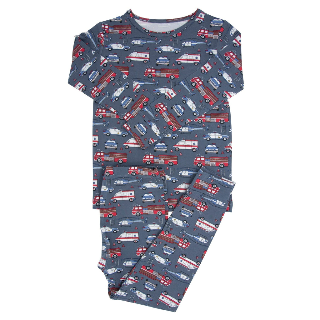 Kids long-sleeve pajama set with navy fire truck pattern, matching pants