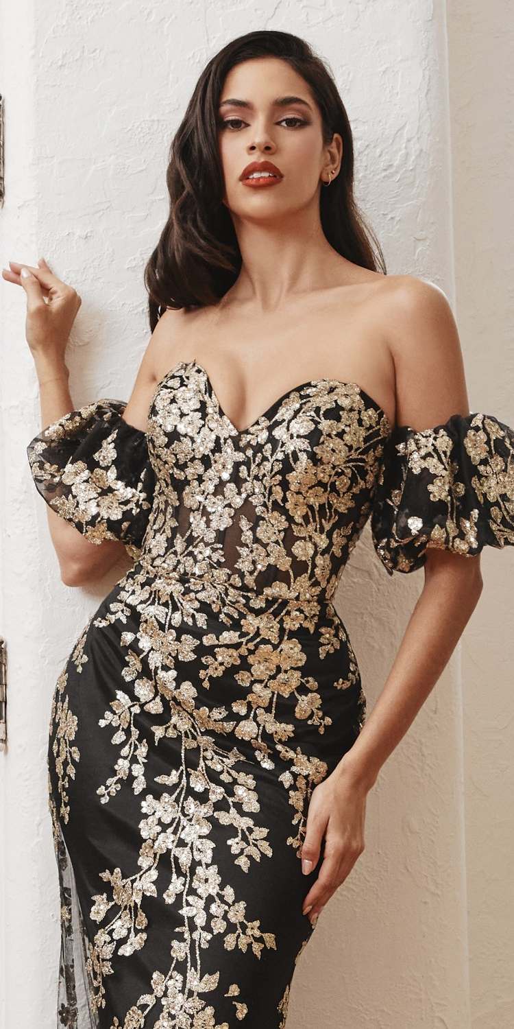 Strapless black glitter gown with gold floral print and detachable puff sleeves.
