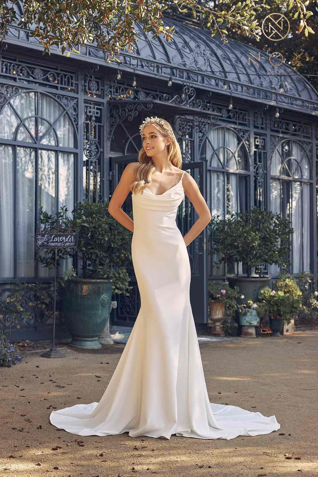 White sleeveless mermaid gown with cowl neckline and long flowing train