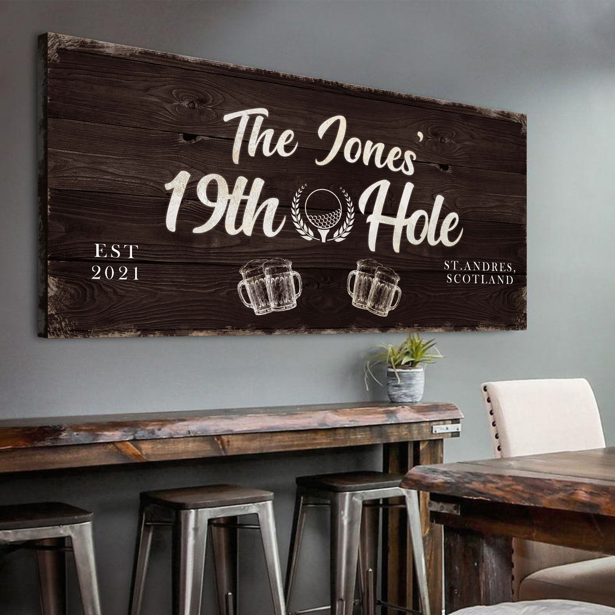 Personalized 19th Hole golf sign on wood reading 'The Jones' and 'Est 2021' with mugs
