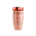 Kérastase Discipline gentle shampoo bottle, peach-pink with red label and silver cap