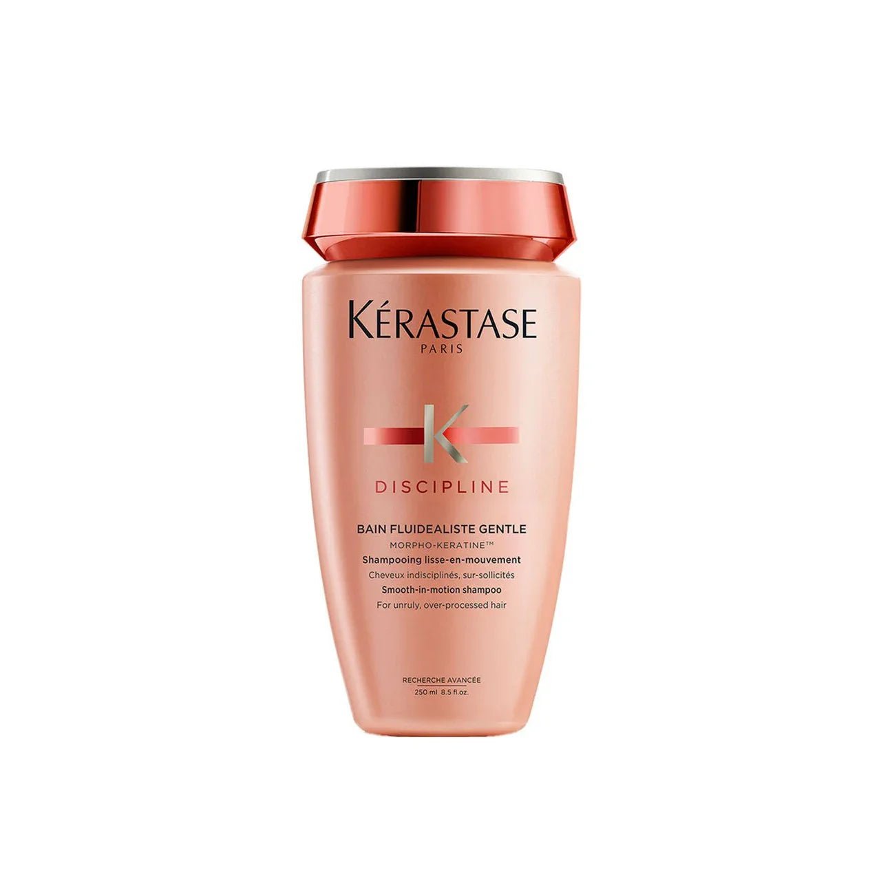Kérastase Discipline gentle shampoo bottle, peach-pink with red label and silver cap