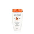 Shampoo bottle with orange cap and white body, Kerastase Nutritive label