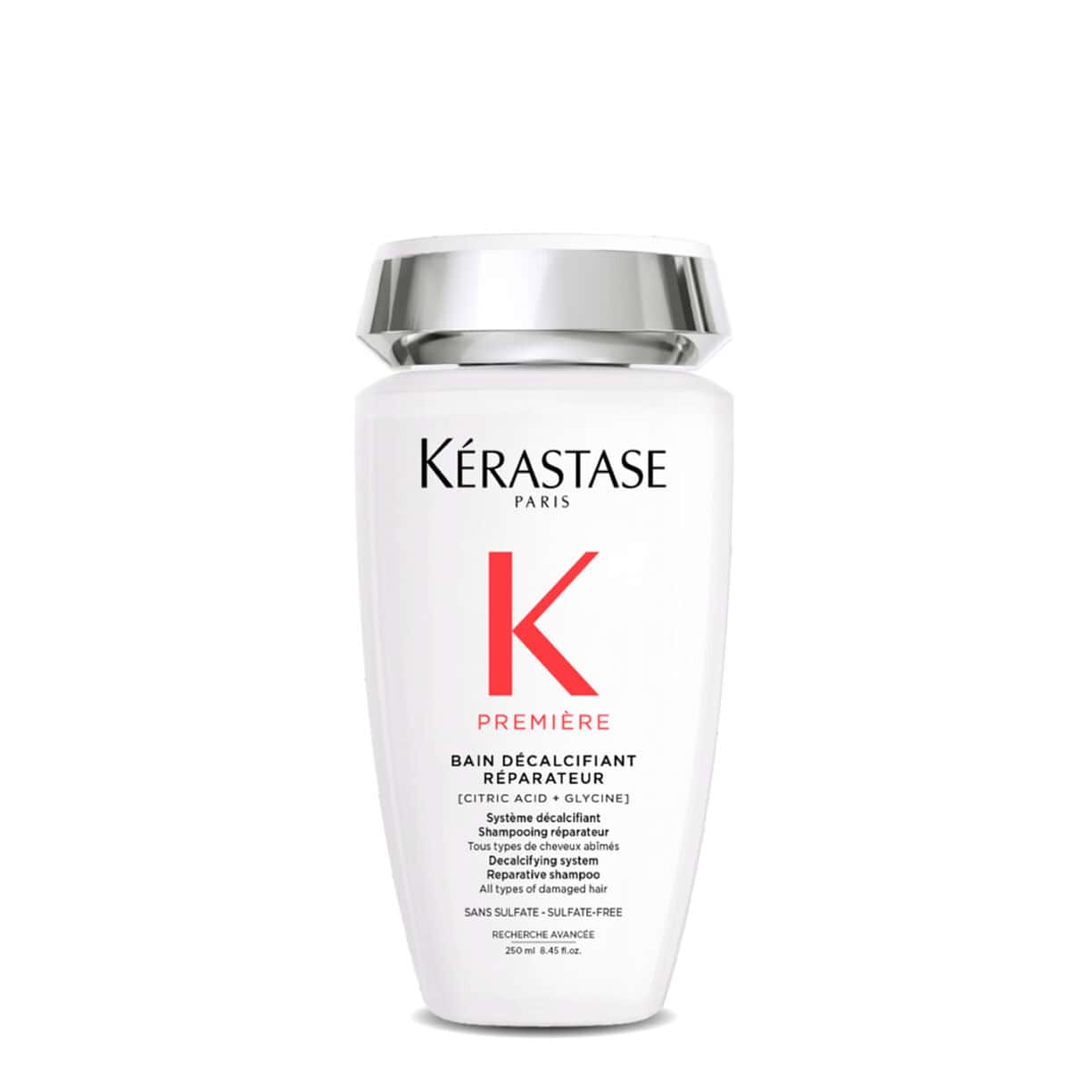 Kerastase Première repairing shampoo bottle, white plastic with silver cap