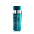 KÉRASTASE hair serum bottle with teal body, silver cap, front label