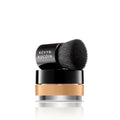 Mini foundation balm with black brush applicator and beige balm layer