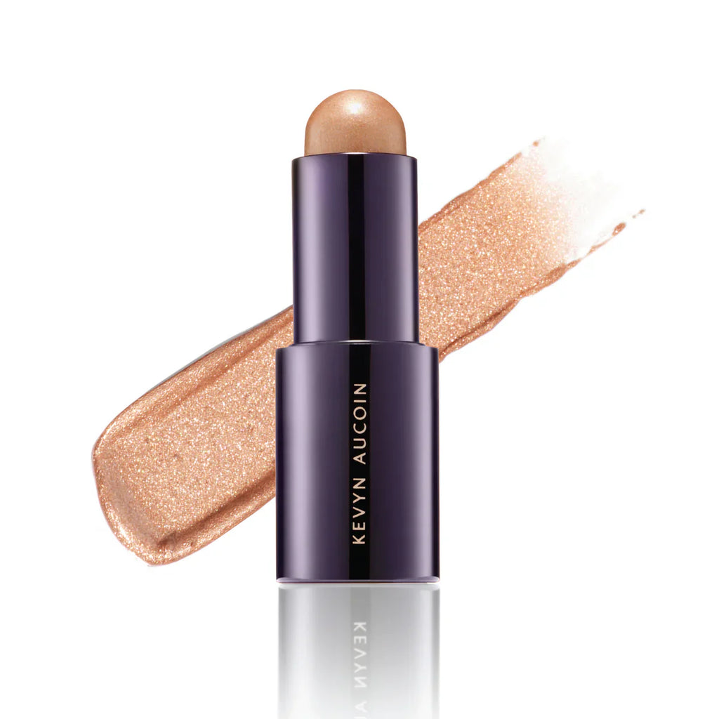 Kevyn Aucoin lighting stick, dark purple tube with bronze shimmer swipe
