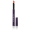 Cream lipstick in a coral-pink shade, with black cap and purple tube.