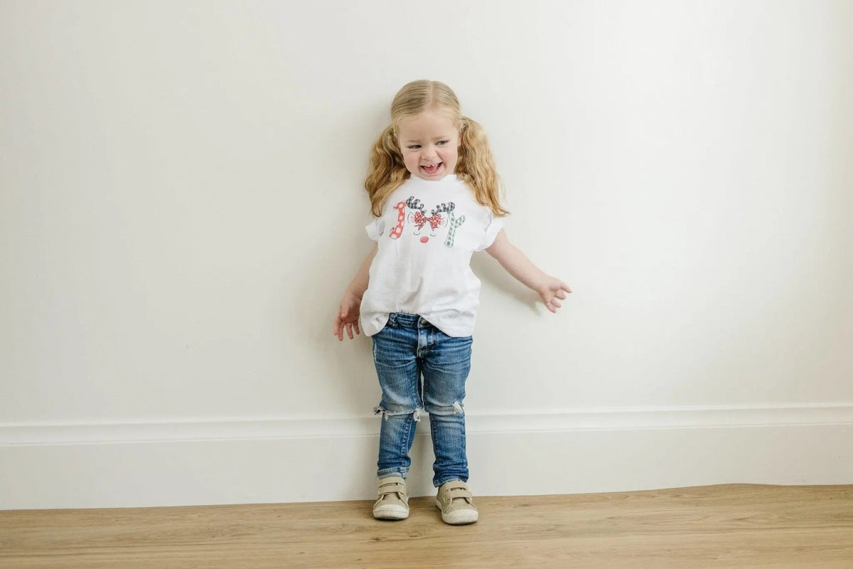 Kids white t-shirt featuring a colorful reindeer graphic on the front