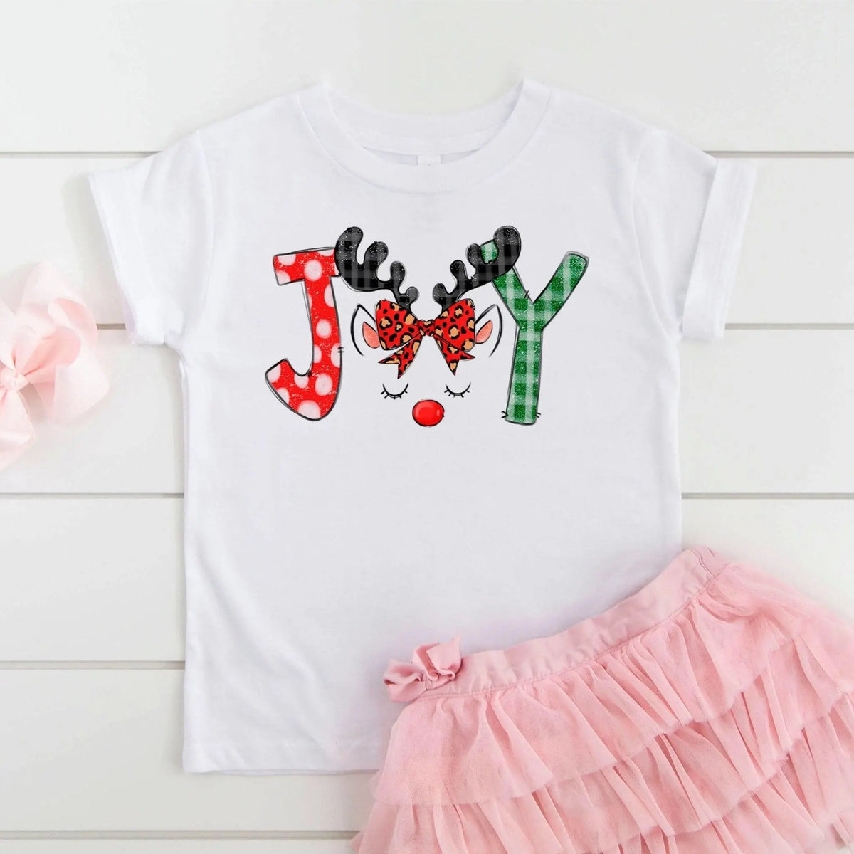 White kids t-shirt with colorful reindeer and candy-cane graphic, short sleeves