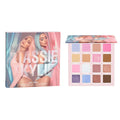 Pressed powder palette with 16 pan shades: pink, beige, brown, and purple.